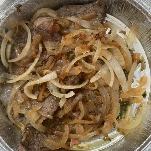 Bistec - Tender steak prepared with traditional Colombian seasonings.