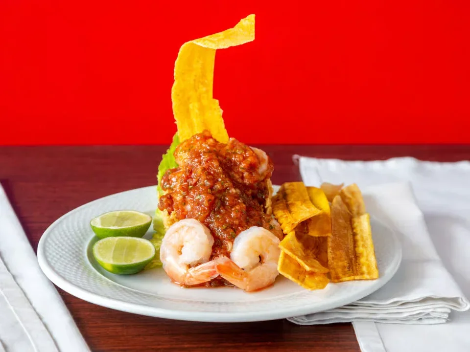 Shrimp Ceviche with Patacones - Fresh shrimp ceviche served with crispy fried green plantains.